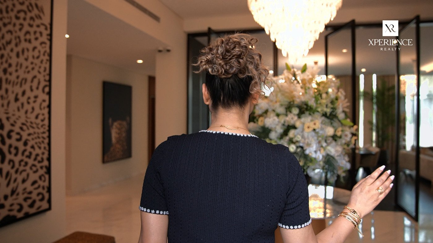 Agent walking through a luxury villa interior