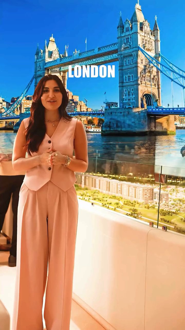 Presenter to camera with Tower Bridge, London